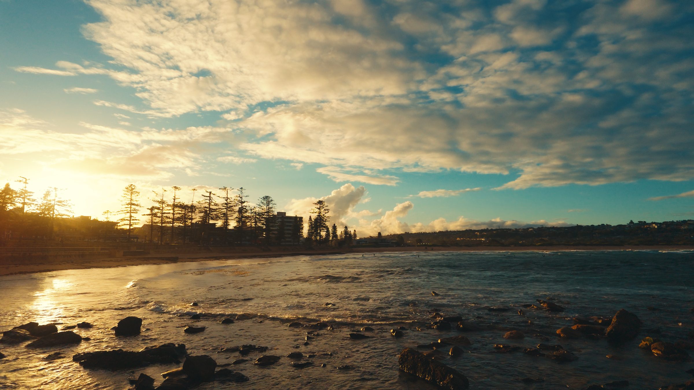 Golden light over a Sydney beach